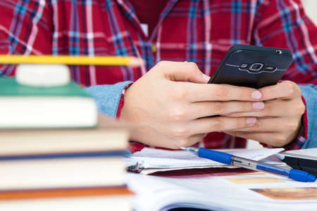 child with the cellphone at schoolの写真素材
