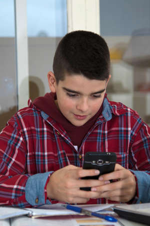 child with the cellphone at school