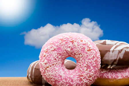 donut stacked and varied on the woodの写真素材