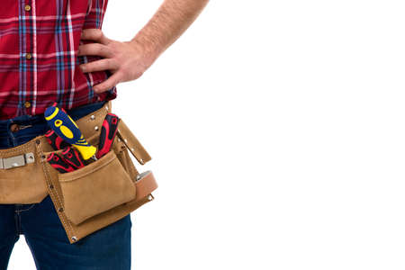 closeup of the bricklayer with tools belt isolated on whiteの写真素材