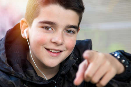 portrait of boy handsome to outdoors pointing