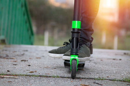closeup of the feet on the scooter, urban sports and fashionsの写真素材