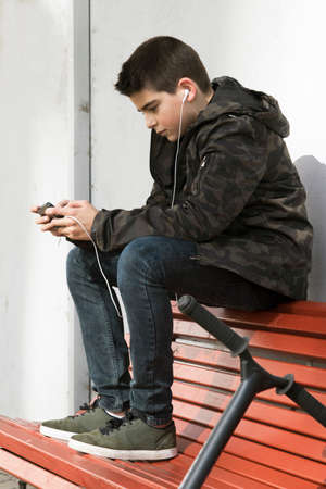 child in old school with the phone mobile to open air