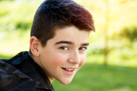 young boy portrait outdoorsの写真素材