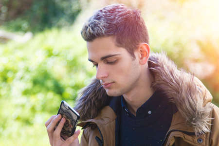 boy teenager with the mobile outdoor