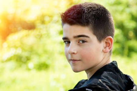 young boy portrait outdoorsの写真素材