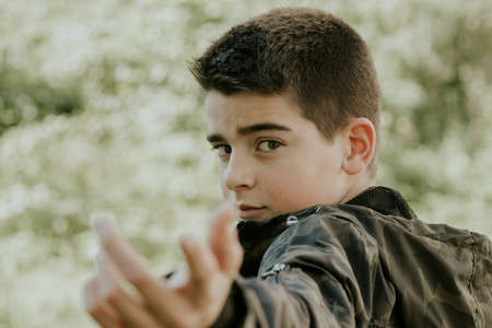young boy portrait outdoorsの写真素材