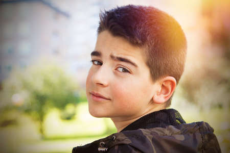 young boy portrait outdoorsの写真素材