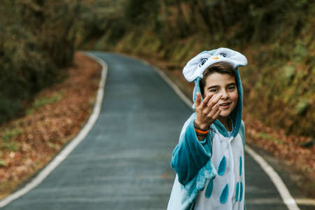 portrait of a boy disguised as having fun outdoorの写真素材