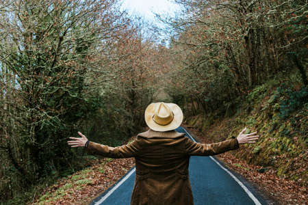 modern hipster hat and arms open to the outdoorsの写真素材