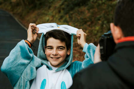 disguised as posing for the photographer smiling boyの写真素材