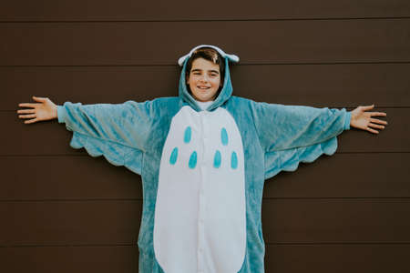 child outdoor playing and having fun dressed up as on a backgroundの写真素材