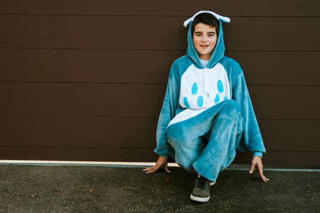 child outdoor playing and having fun dressed up as on a backgroundの写真素材