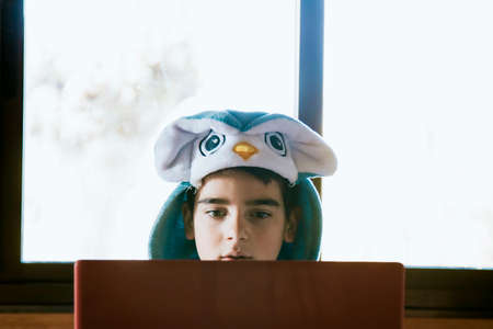 child with the costume and the laptopの写真素材