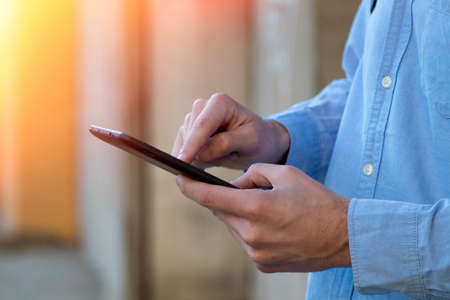 hand with the digital tablet outdoors