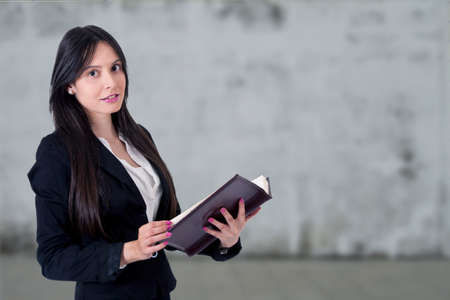 businesswoman with address book or calendarの写真素材