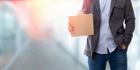 man with the folder documents and space for text or adsの写真素材