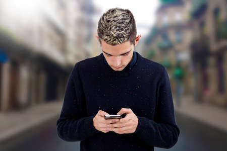 man young teen with the phone mobile