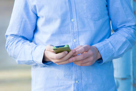 closeup of hands with the mobile phone