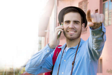 male young modern in the street speaking by phone mobileの写真素材