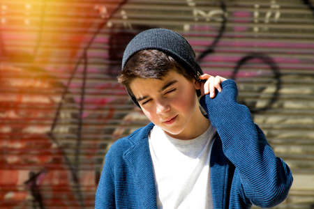 child in the street of the city, urban style outdoor