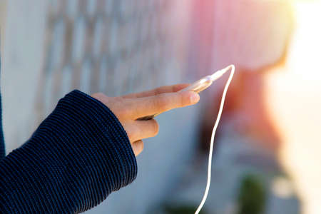 closeup of hands of the child with the mobile phone