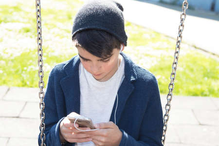 child with outdoor mobile phone