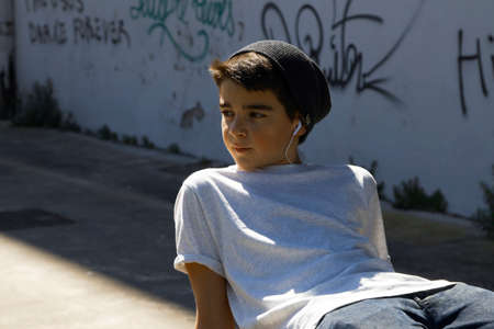 portrait of a boy outside with headphones
