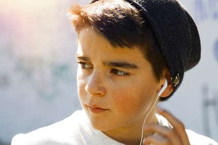 portrait of a boy outside with headphones