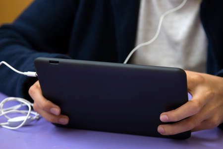 child smiling with the digital tablet or e-bookの写真素材