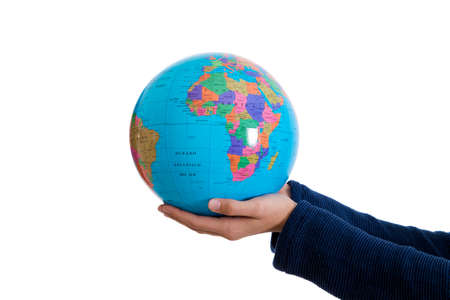 hands holding the world isolated on white ballの写真素材