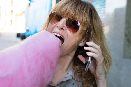 young woman with cotton candy at the party