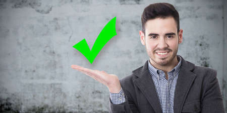 man smiling with the sign of approvalの写真素材