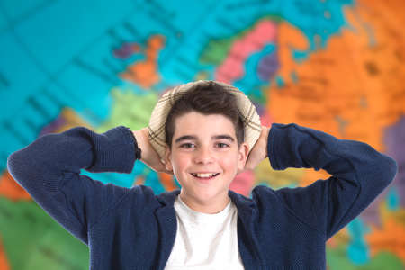 portrait of a boy with the background world mapの写真素材