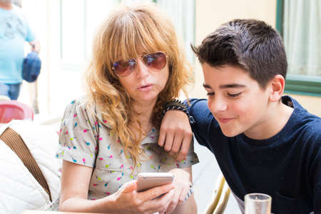 famyly with mobile phoneの写真素材