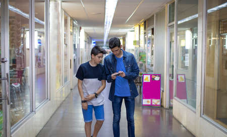 friends with the mobile in the cityの写真素材