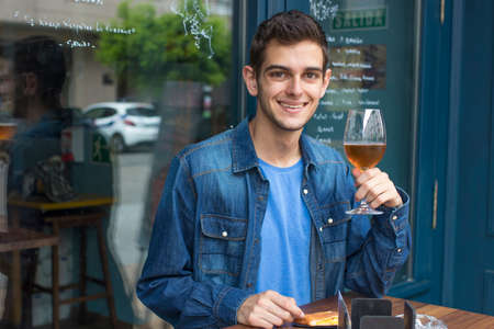 modern man at the bar drinking a beer