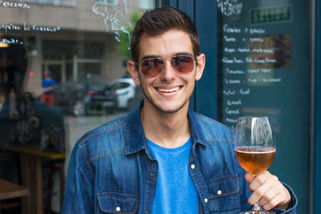 modern man at the bar drinking a beer