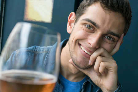 modern man at the bar drinking a beer