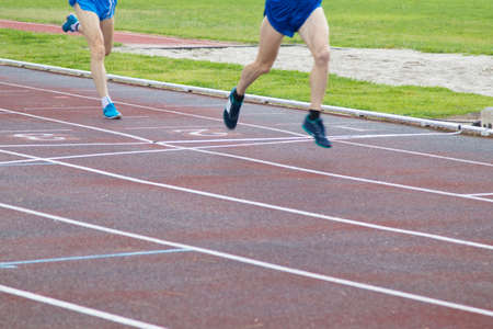 athletes running on the athletics trackの写真素材