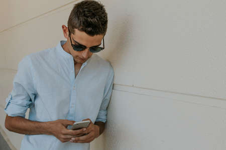 yong man with cellphoneの写真素材