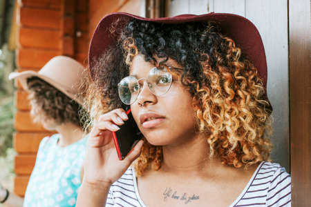 young woman talking on mobile phone fashionの写真素材