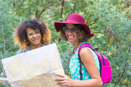 friendly young girls trip with mapの写真素材