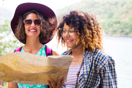 young friends of tour and travel with holiday mapの写真素材