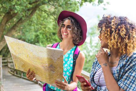 young friends of tour and travel with holiday mapの写真素材