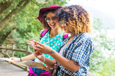 friends with the phone for travel and excursionの写真素材