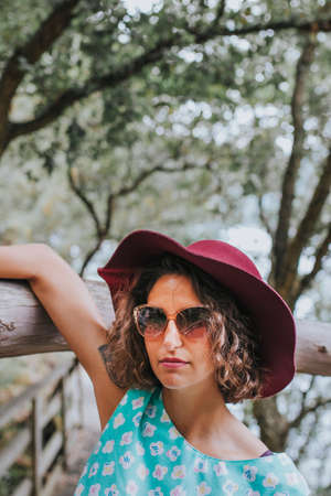 portrait of young girl to fashion with a hat outdoorsの写真素材