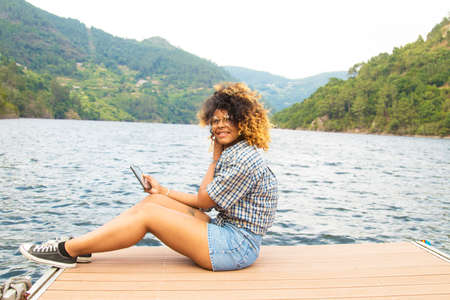 girl with the tablet's summer vacationの写真素材