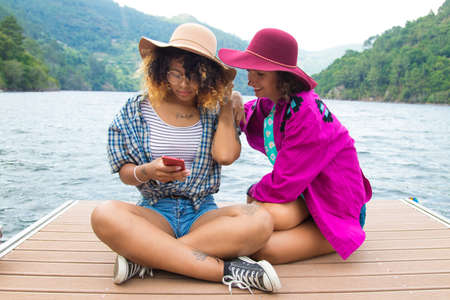 friends with the mobile outdoorの写真素材