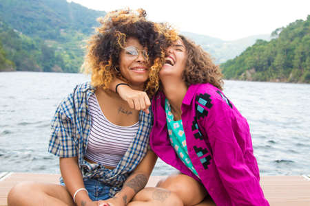 friends sharing and laughing out loud summer tourの写真素材